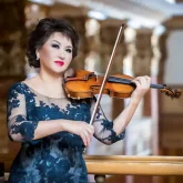 «Ректорлық лауазымын қайтарып беремін»: Скрипкашы Айман Мұсақожаева алаяқтардың құрбаны болды